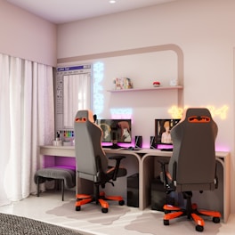 Two gaming chairs and desks with computers.