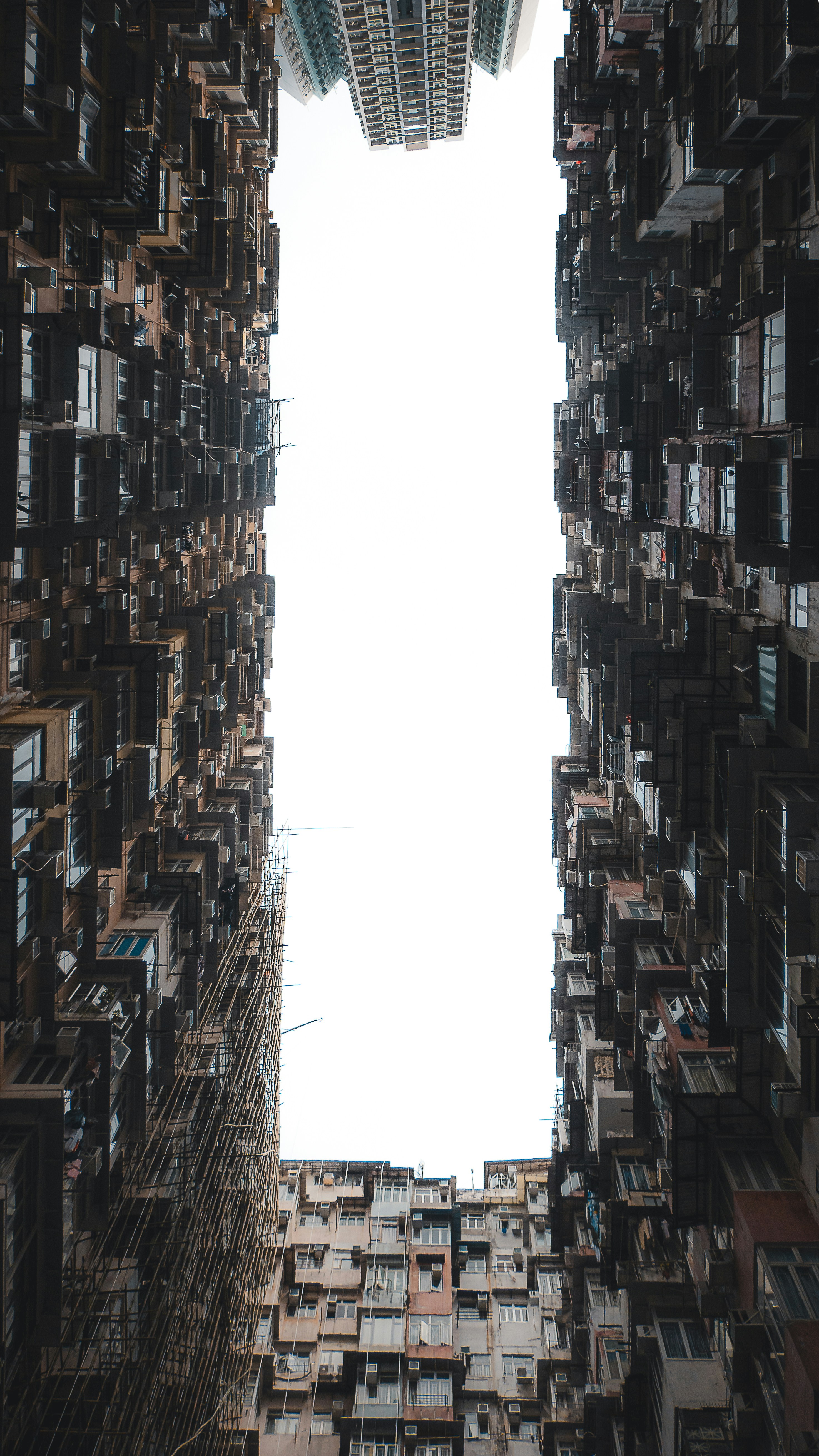 Tall apartment buildings create a narrow canyon effect.