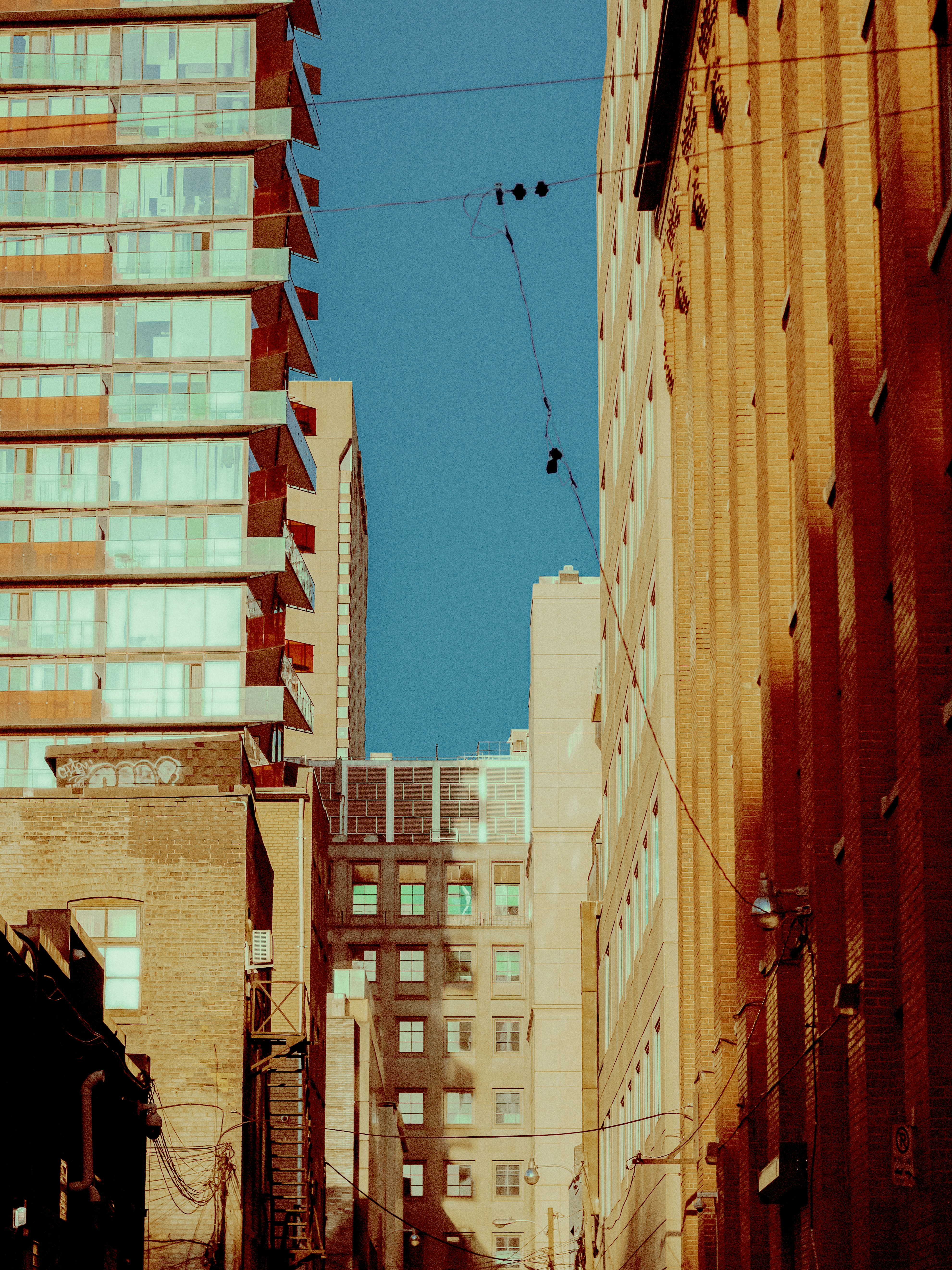 Tall buildings against a clear blue sky