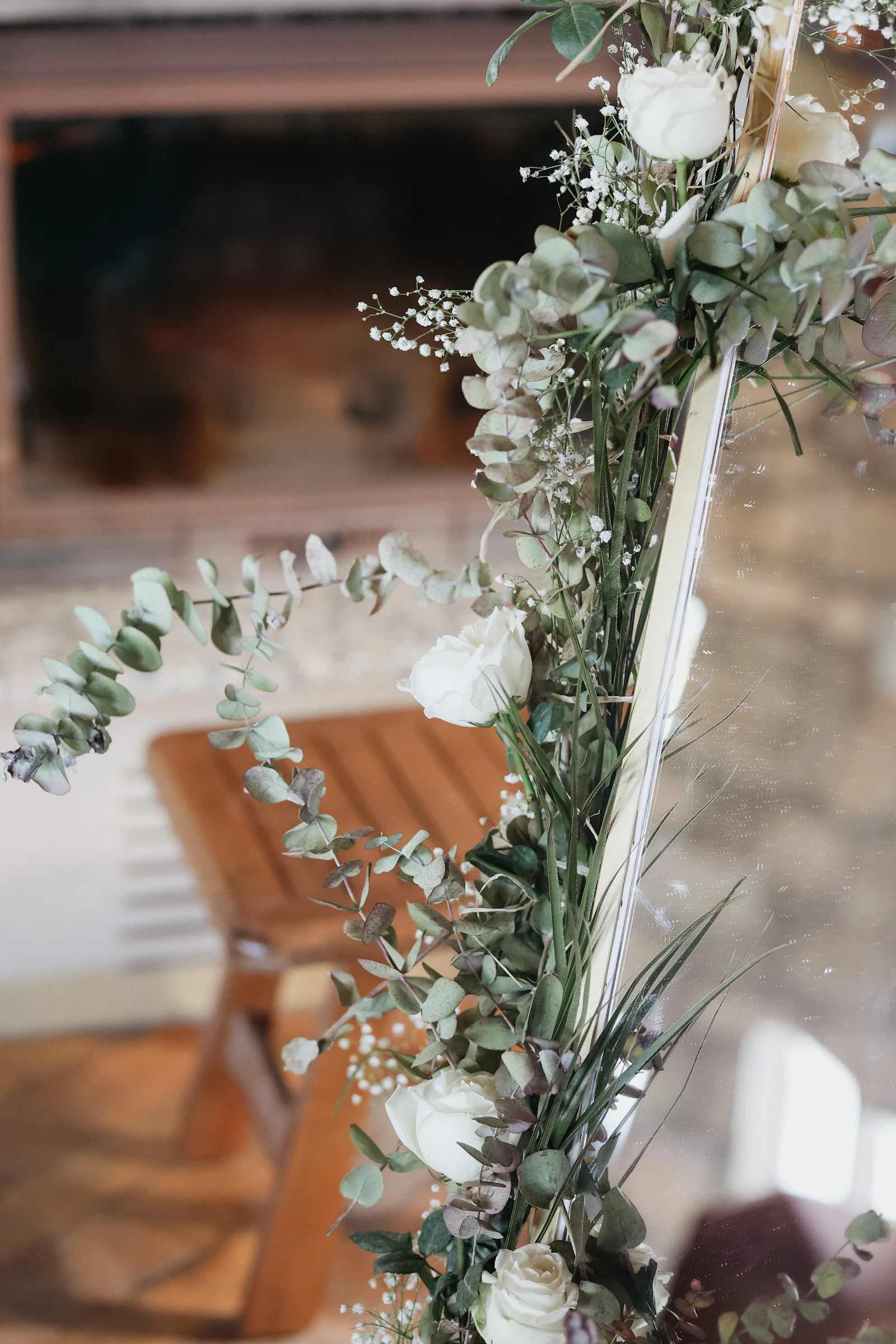 Cream garden roses and eucalyptus bouquet in an earthy, neutral palette