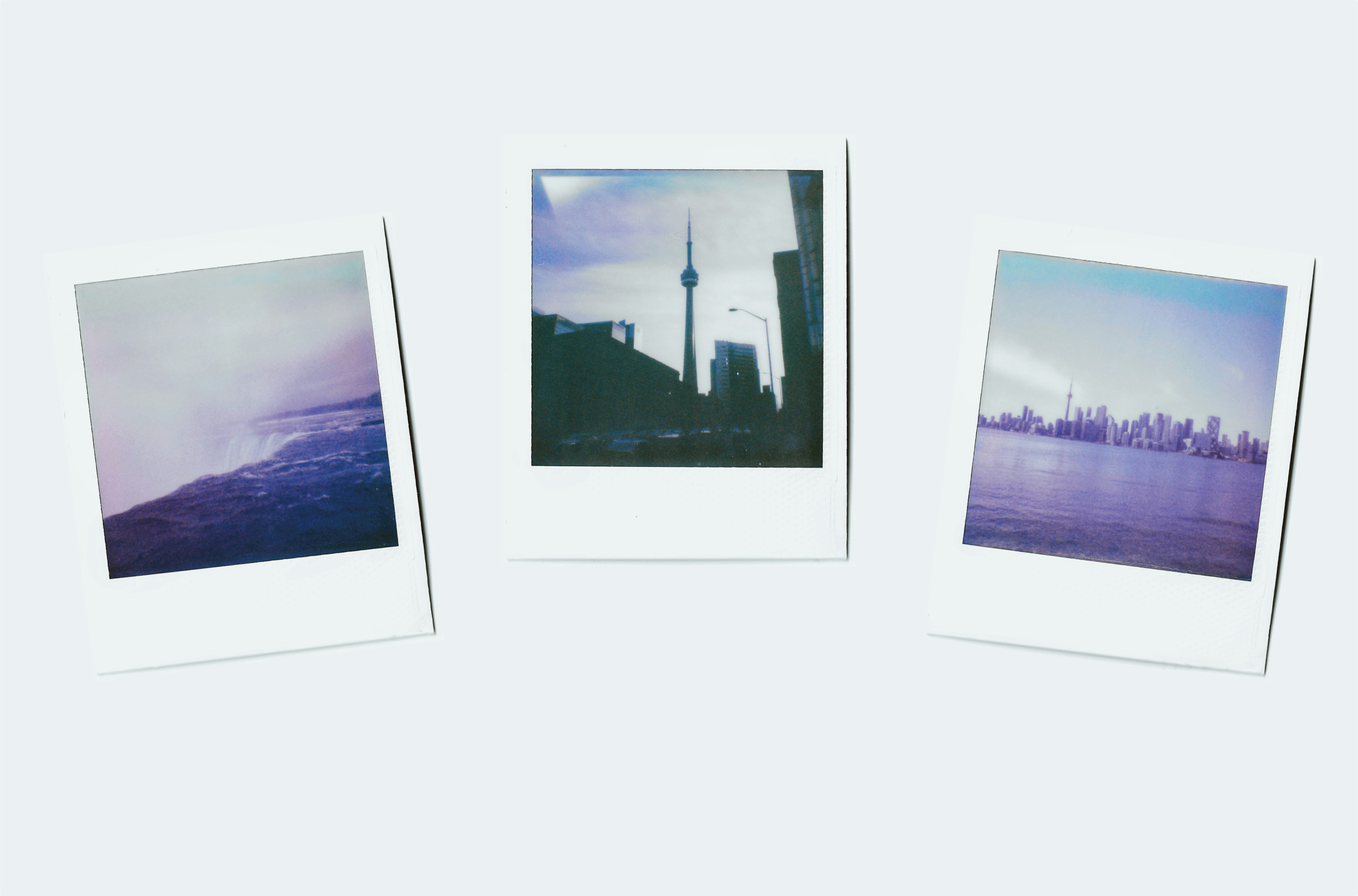 Three polaroid photos of cityscapes