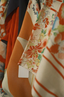 Close-up of colorful floral patterned silk kimono fabric.