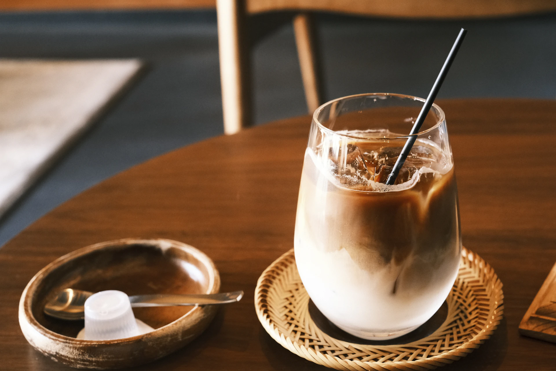 Iced coffee with cream and ice on a table
