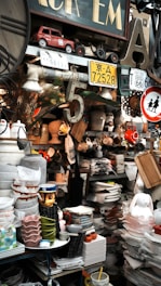Cluttered shelves filled with vintage items and dishes.