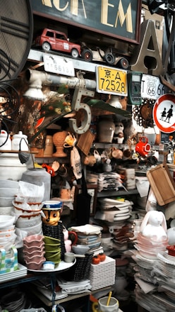 Cluttered shelves filled with vintage items and dishes.