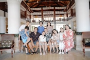 A large family posing for a group portrait indoors.