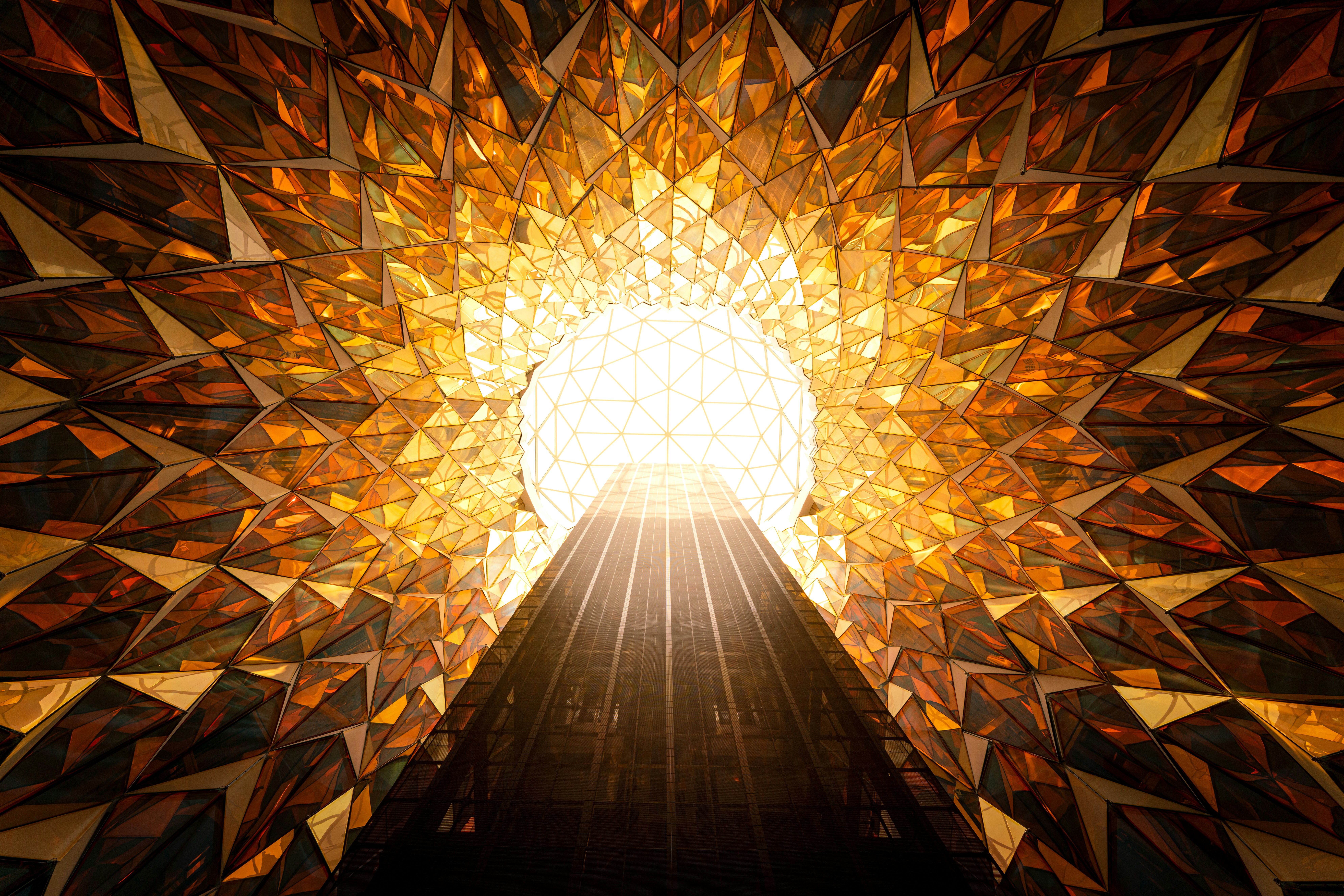 Abstract golden tunnel with bright light at the end