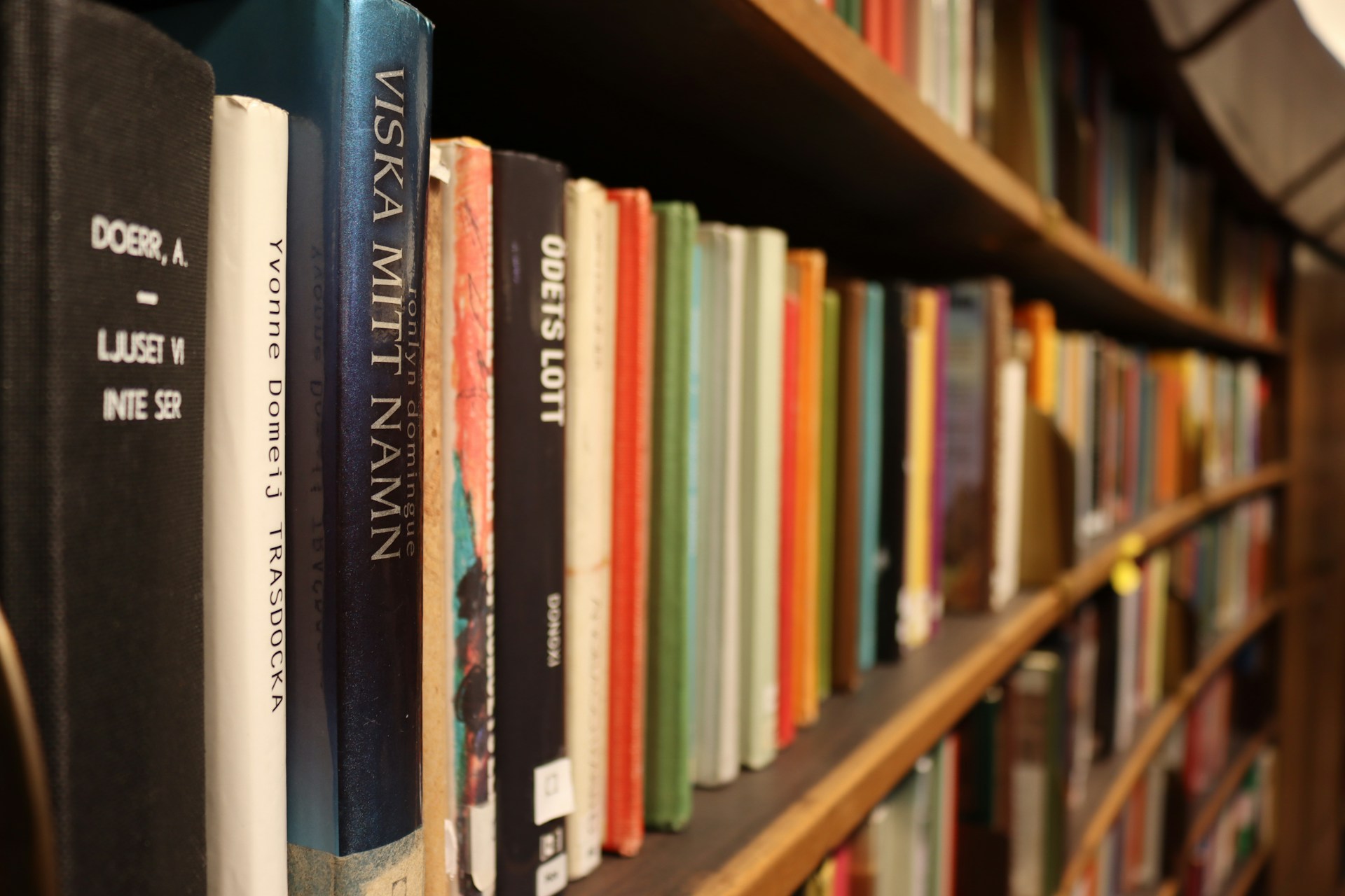 A bookshelf filled with colorful books.