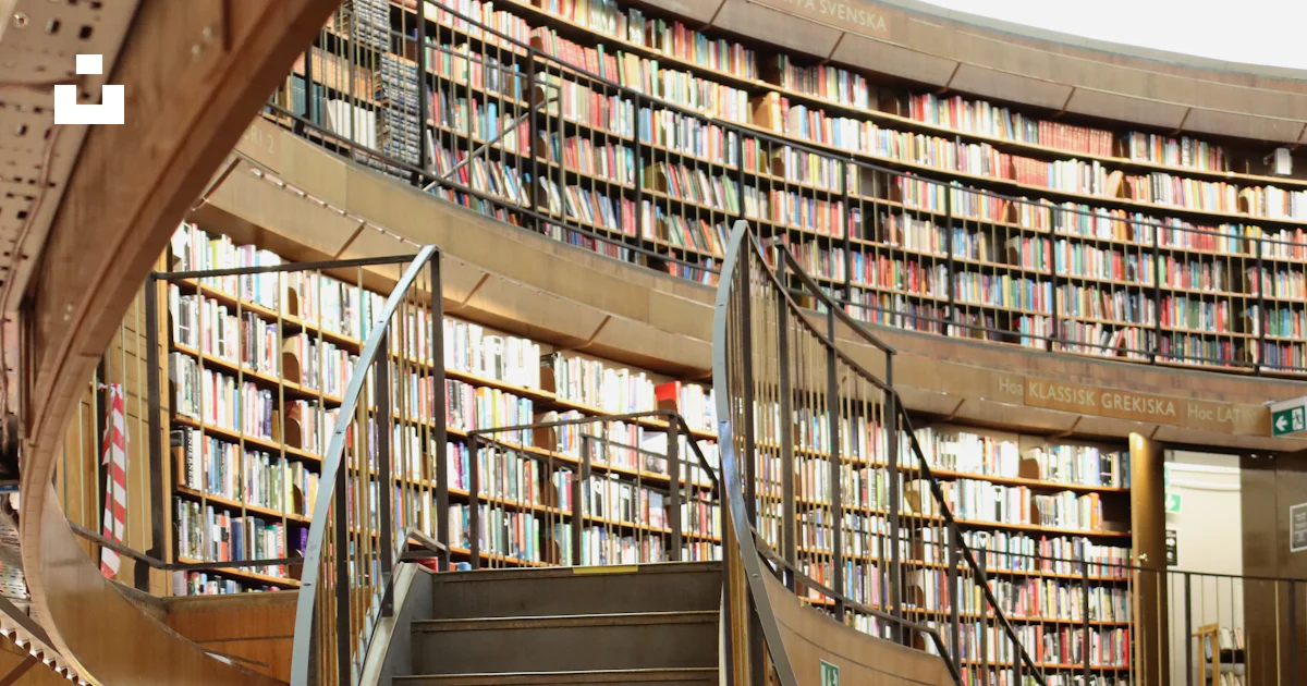 Circular Ramp Library Circular library interior with grand staircase and bookshelves photo ...