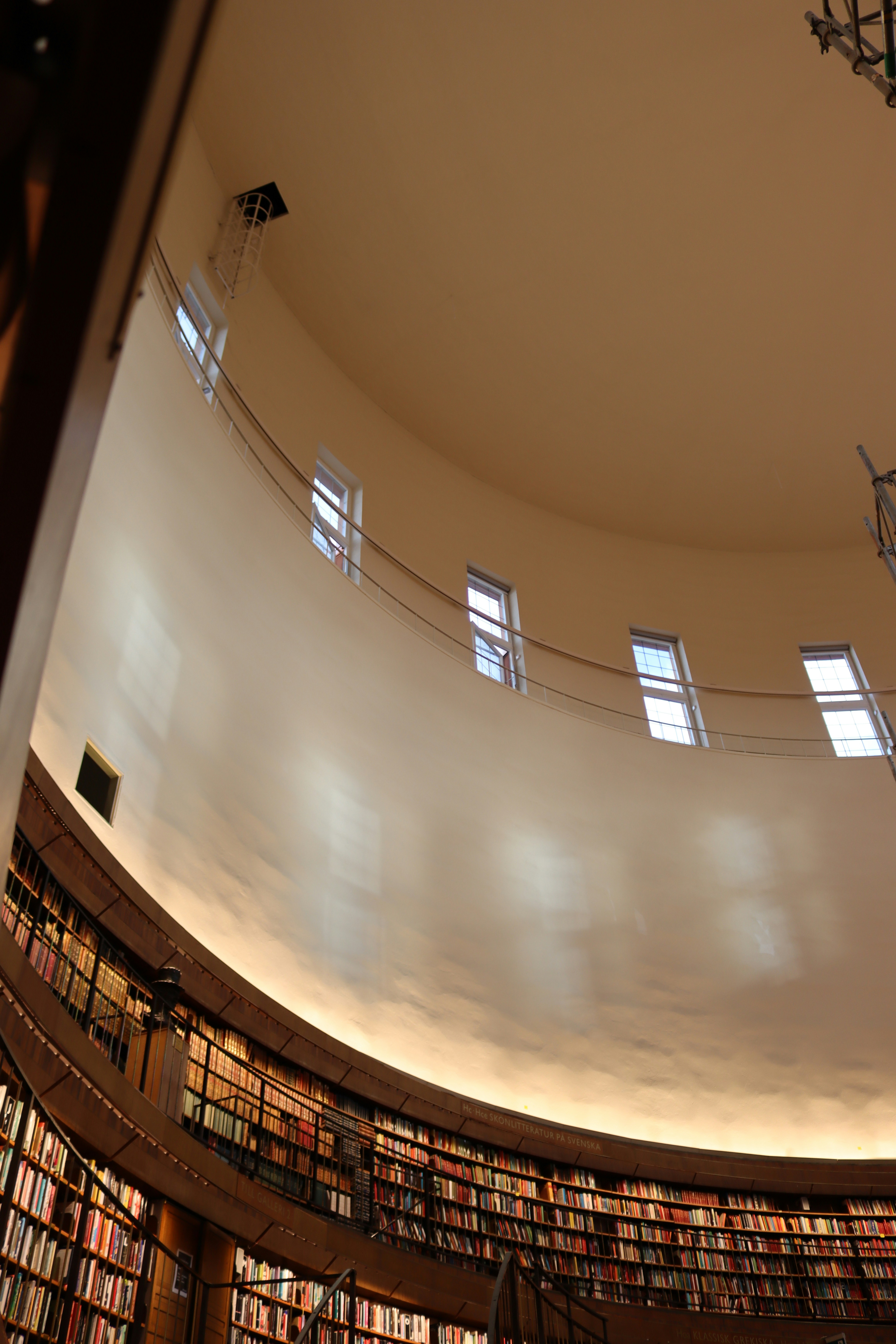 Circular library interior with rows of books