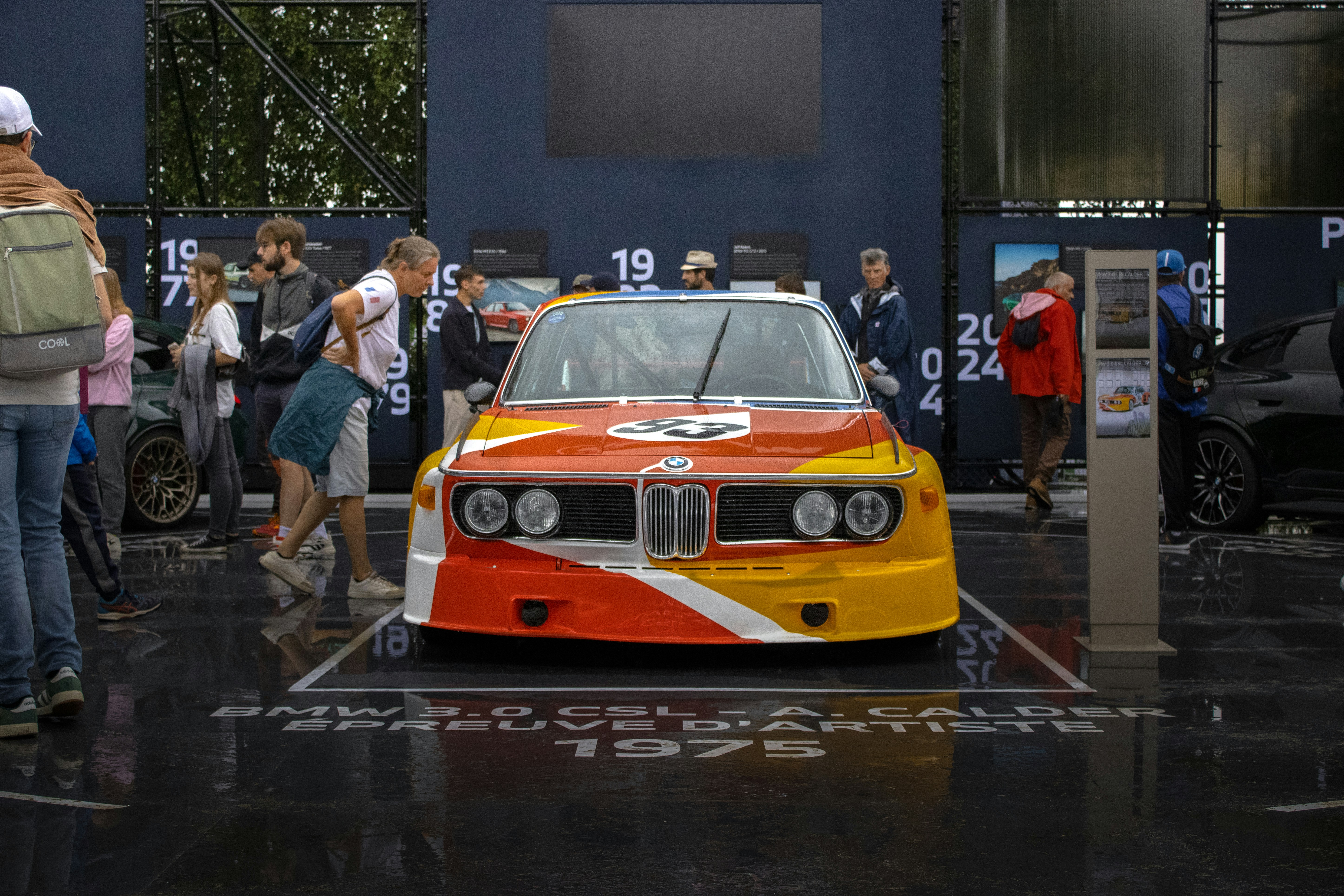 Vintage race car with vibrant red and yellow livery