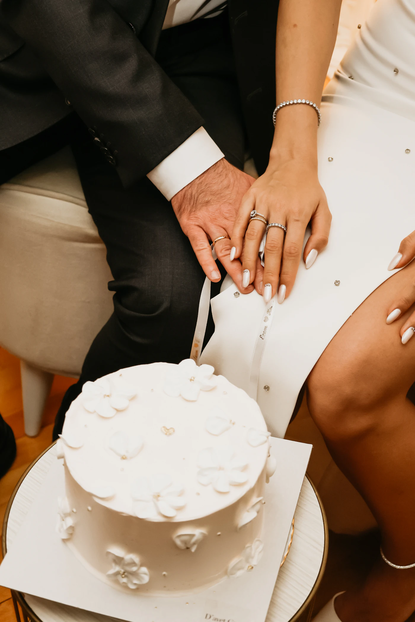 How to find top-rated wedding cake bakers — A couple tasting wedding cake flavors at a bakery consultation.