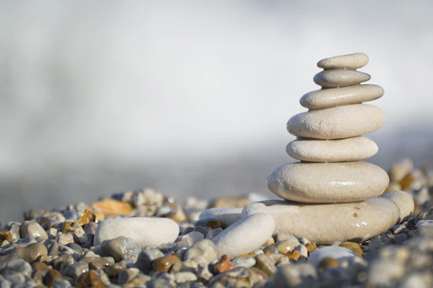 Stack of smooth stones on a pebble beach