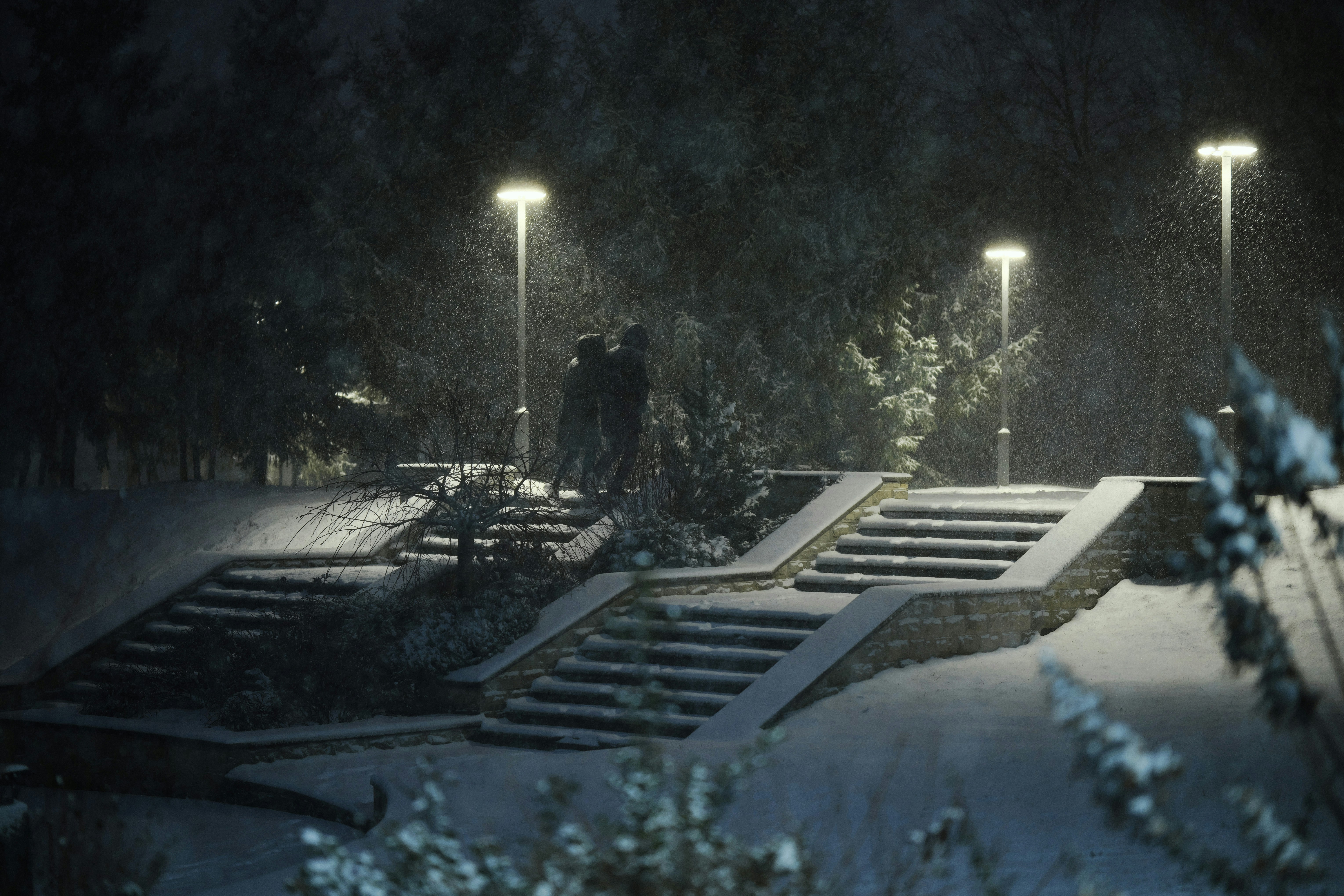 Hujan salju di malam hari menerangi tangga taman dan pepohonan.