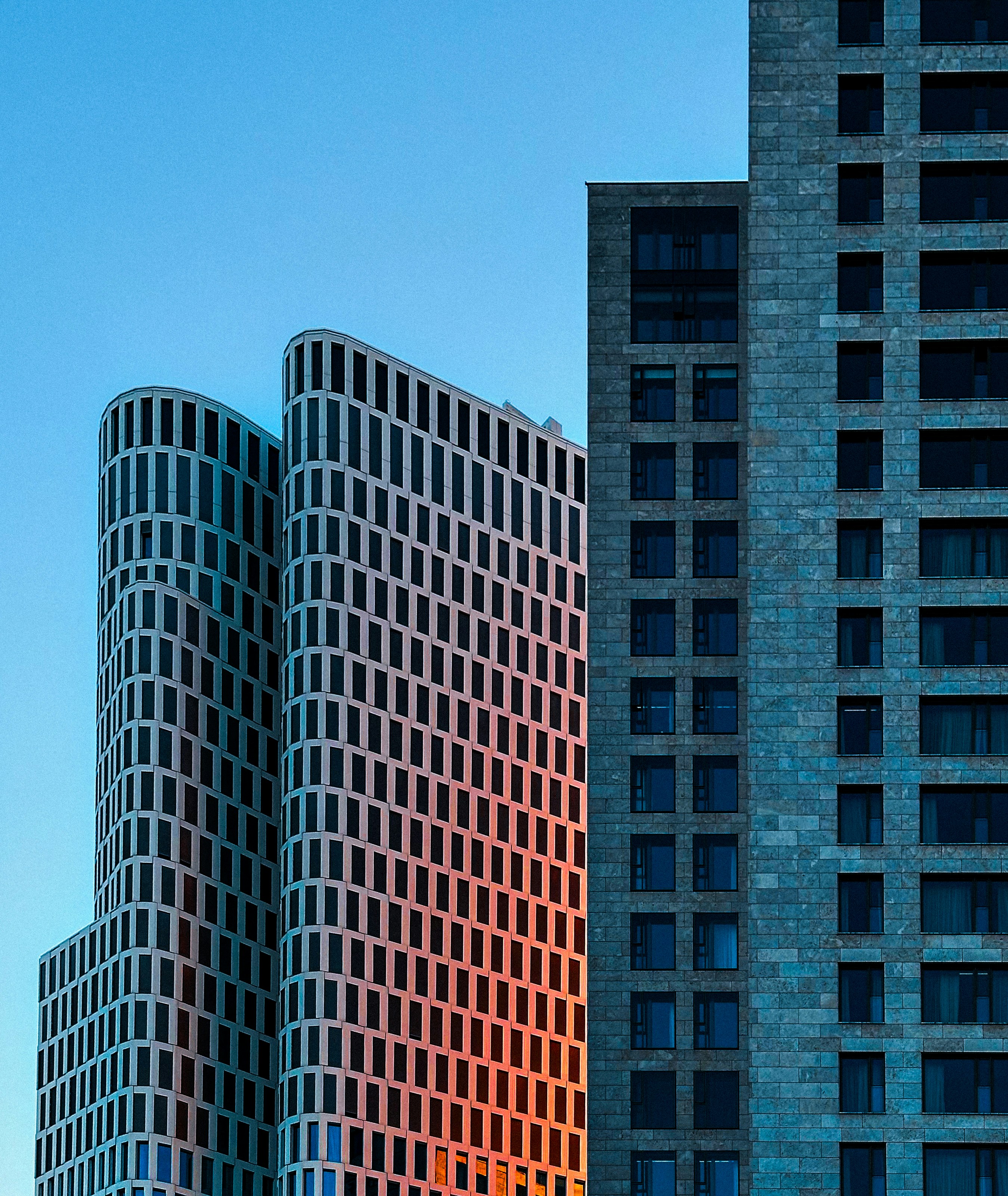 Modern buildings against a clear blue sky