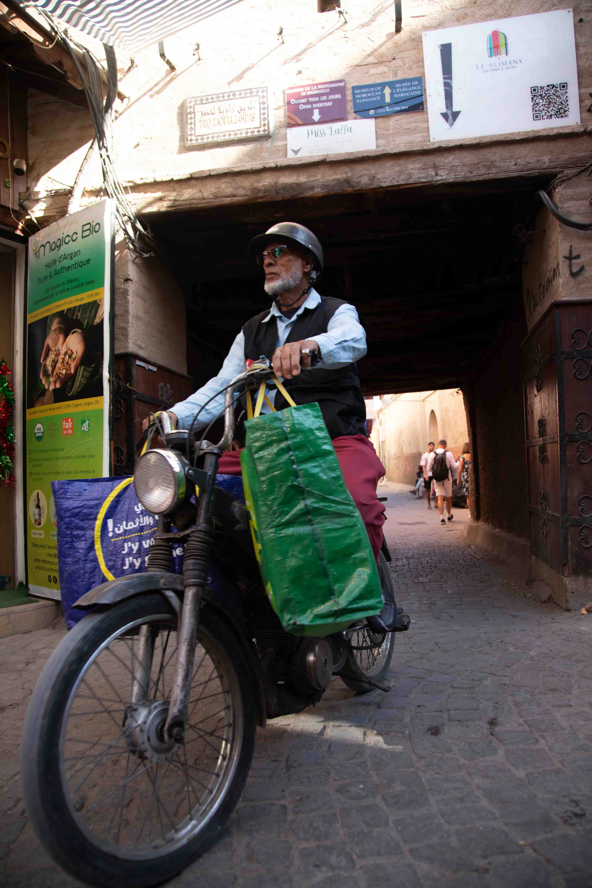 A delivery rider carrying insulated bags