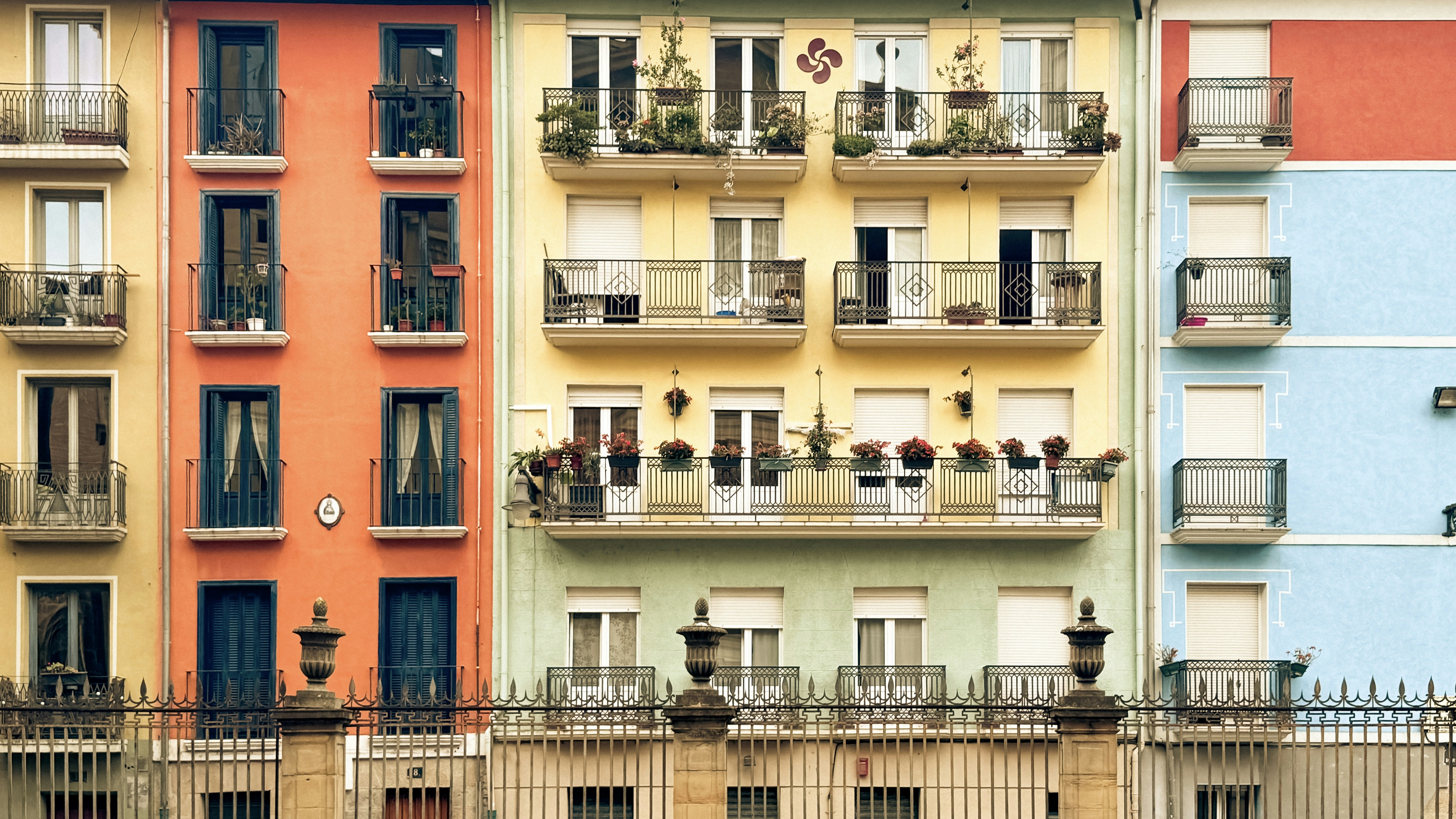 Colorful apartment buildings with balconies and windows
