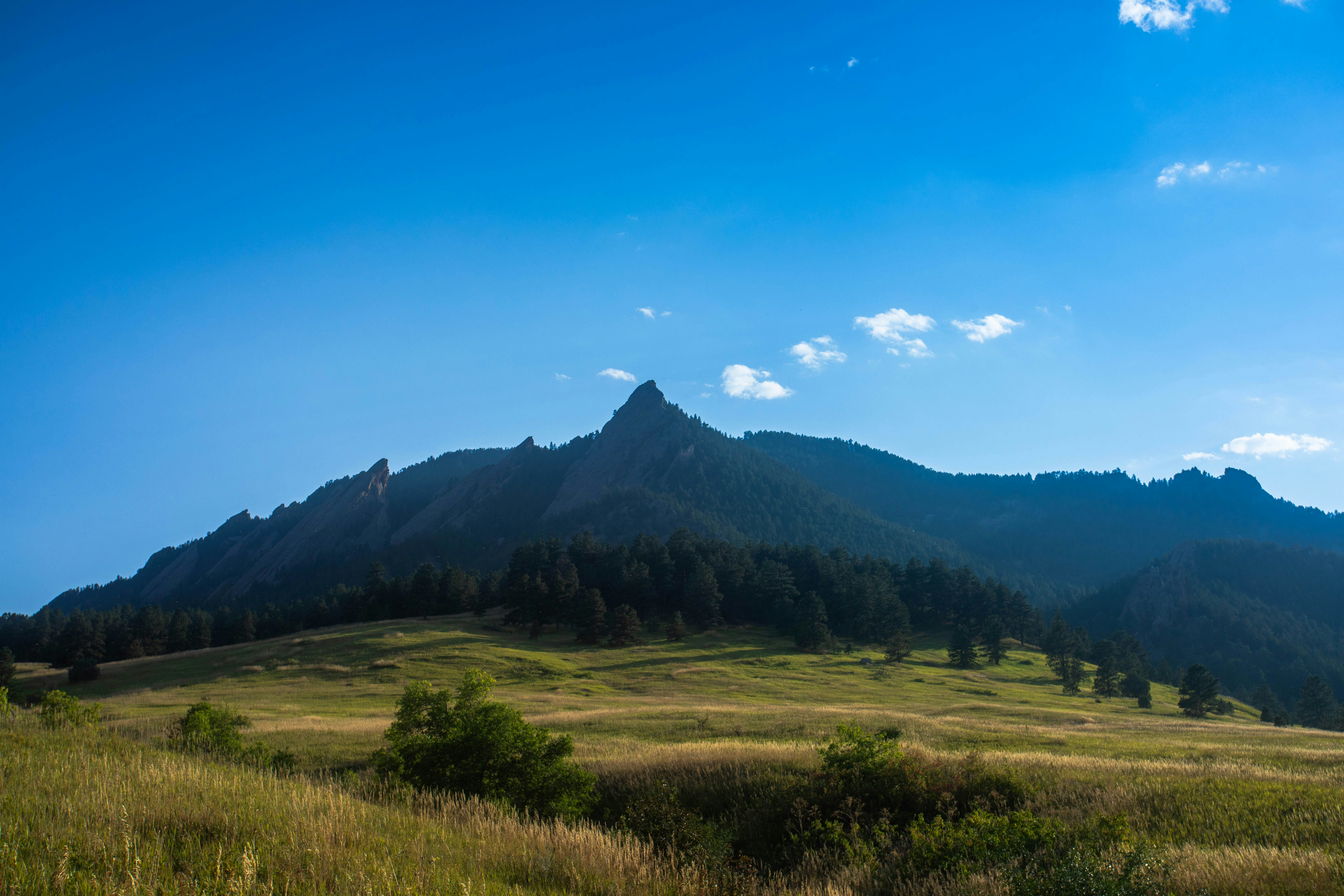 A majestic mountain peak against a clear blue sky.
