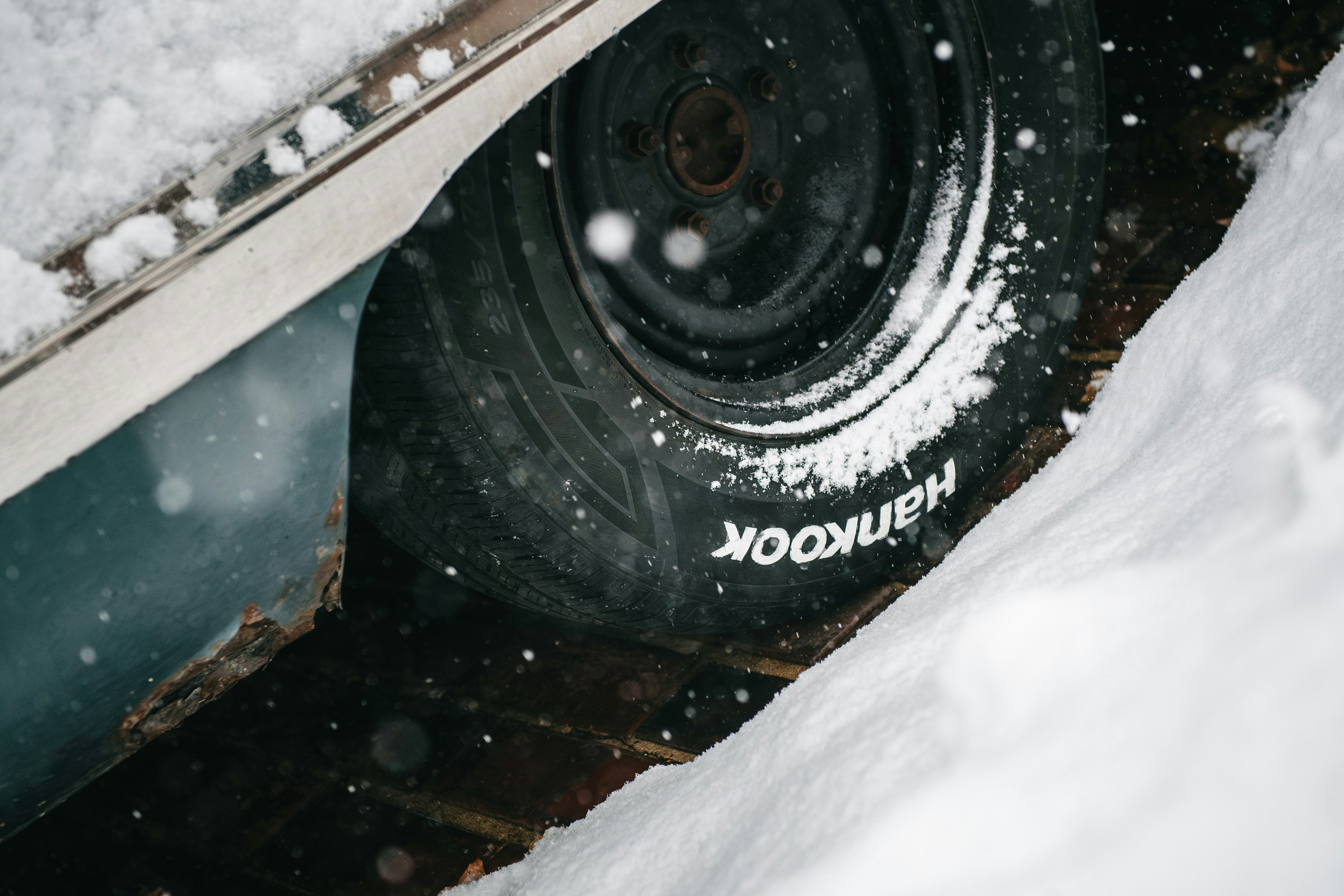 A car tire covered in snow
