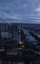 Cityscape with bridges over river at dusk