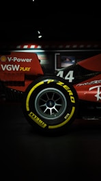 Red race car tire with yellow lettering