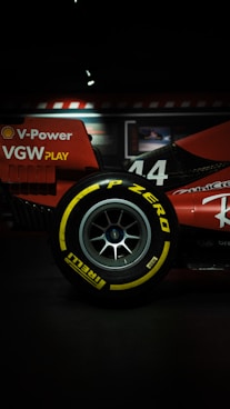 Red race car tire with yellow lettering