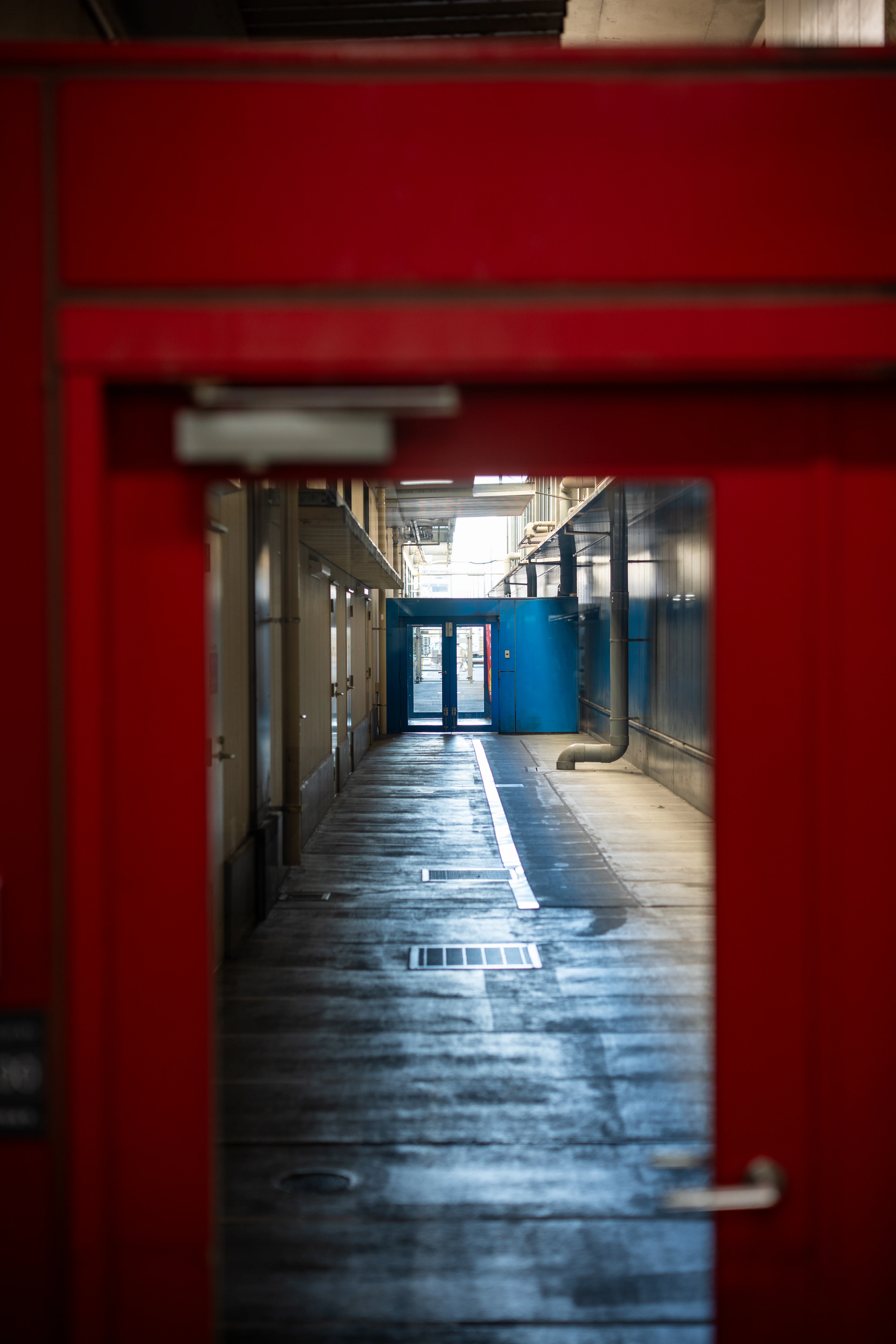 A modern, well-lit storage facility corridor
