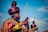 Men in traditional colorful attire and headwraps