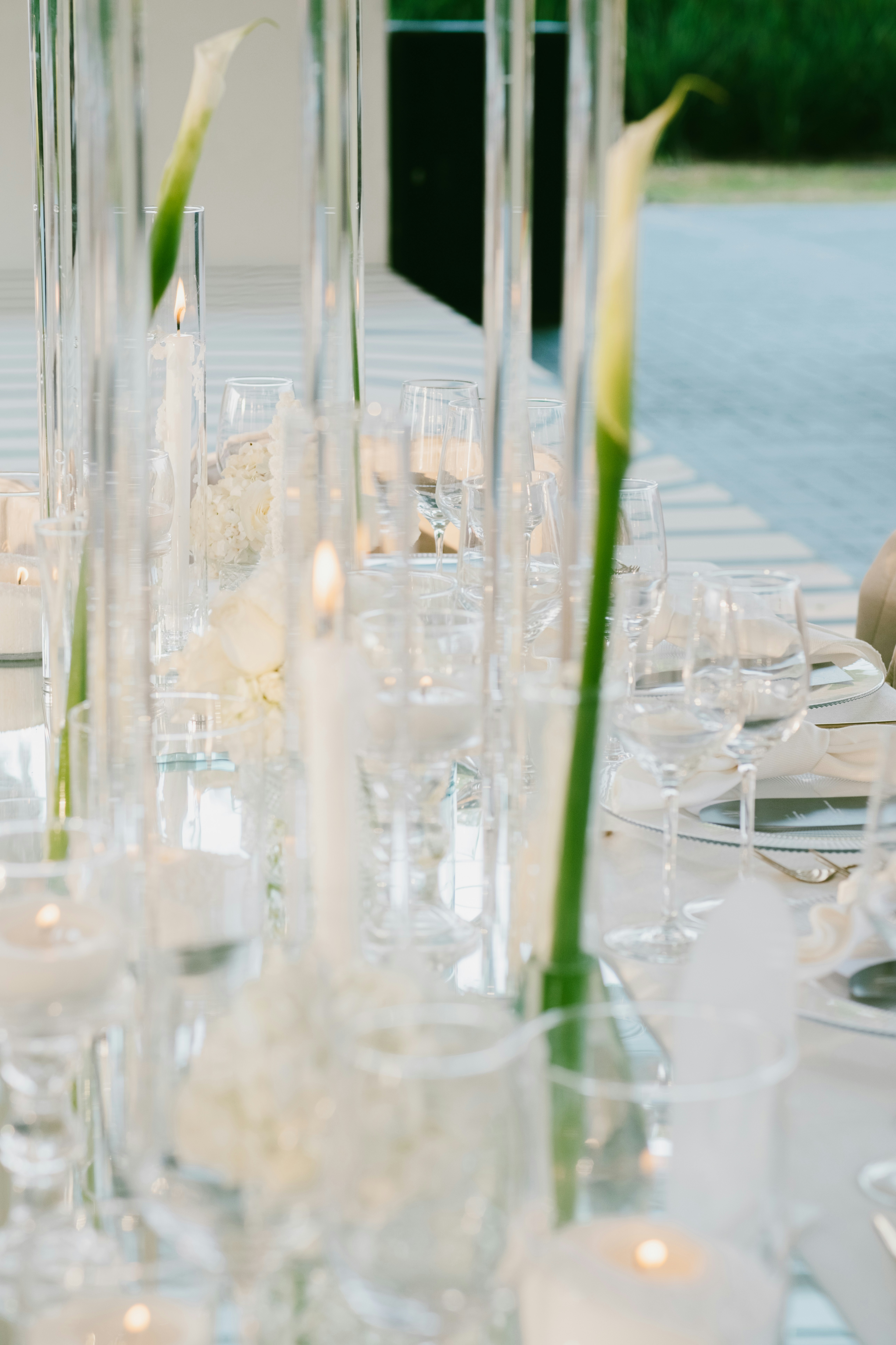 Elegant table setting with calla lilies and candles.