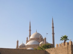Mosque with domes and minarets under a clear blue sky