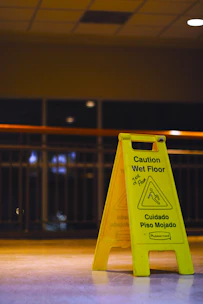 Yellow wet floor caution sign indoors