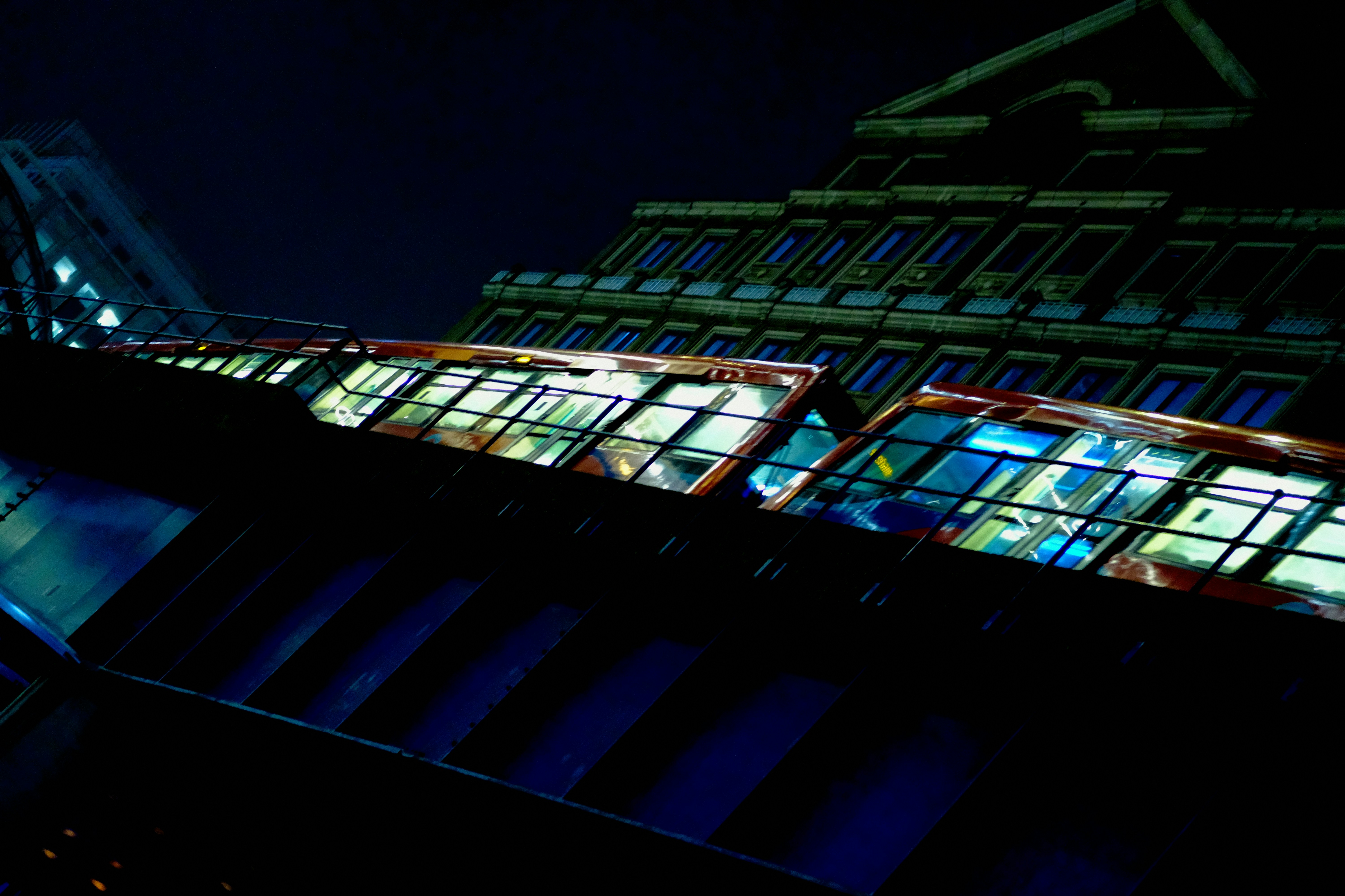 Modern building with illuminated windows at night