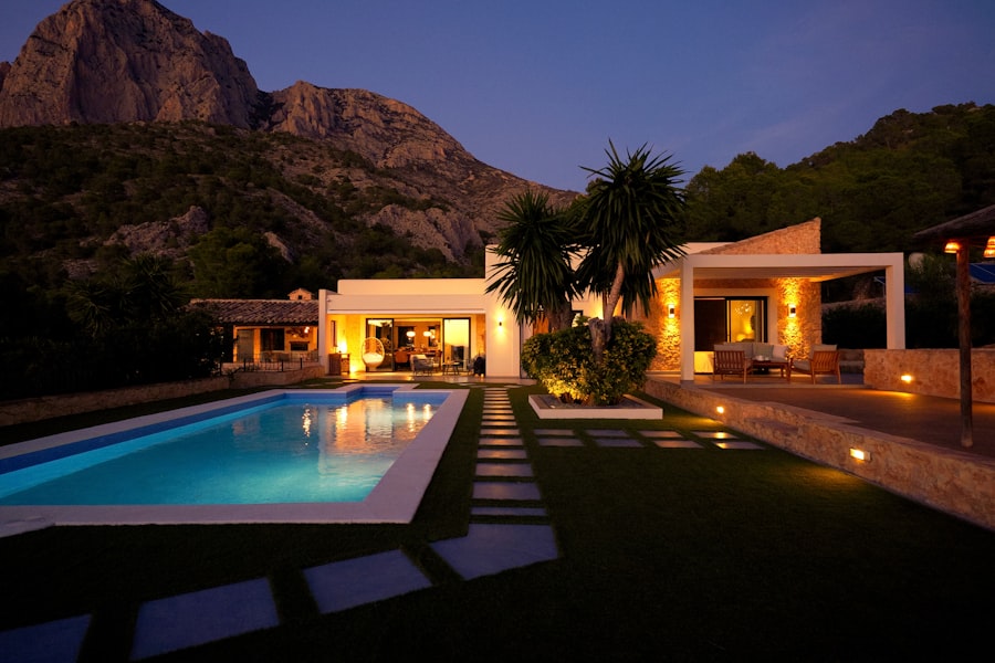 Luxury vacation rental villa with pool at dusk