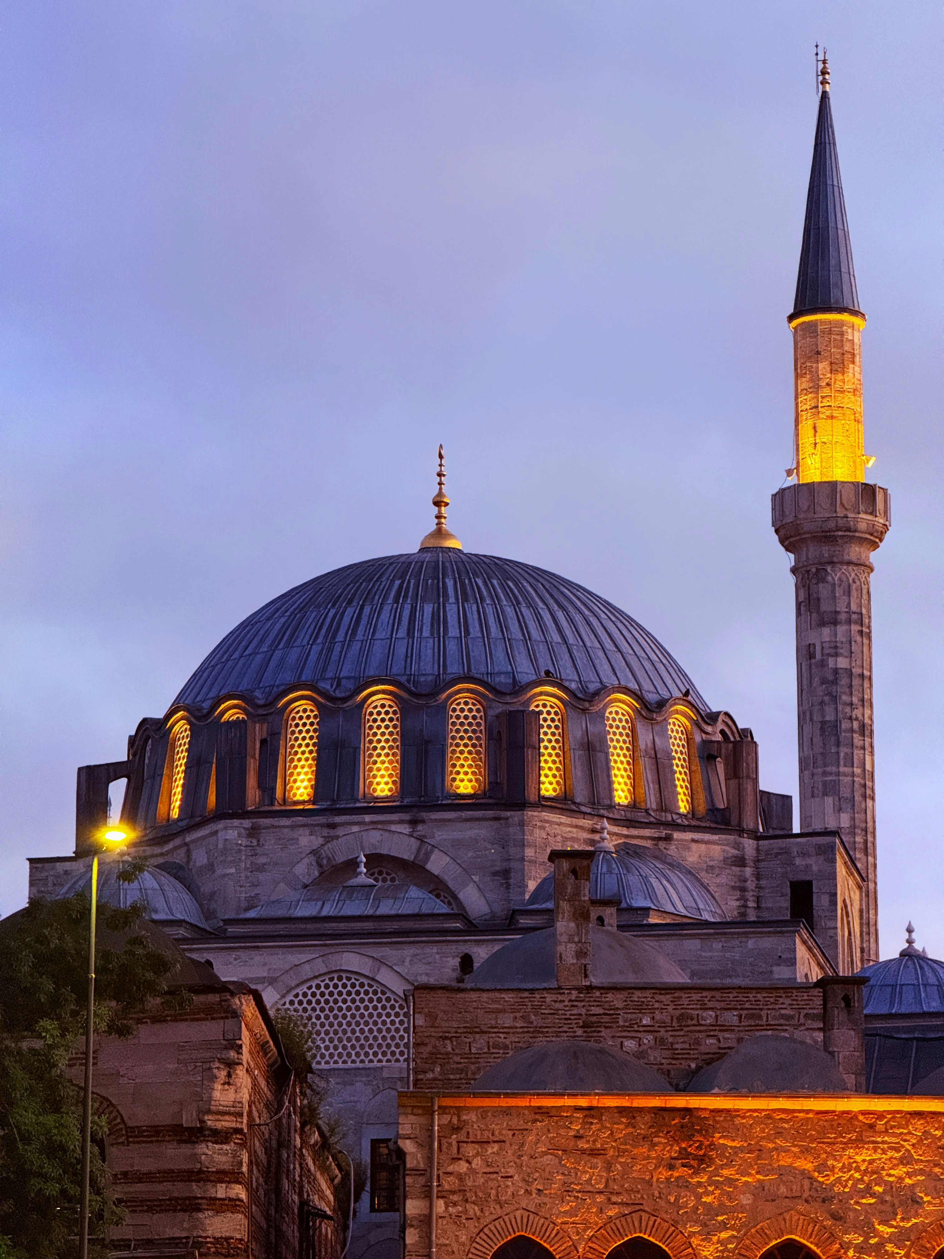 A grand mosque with a large dome and minaret.
