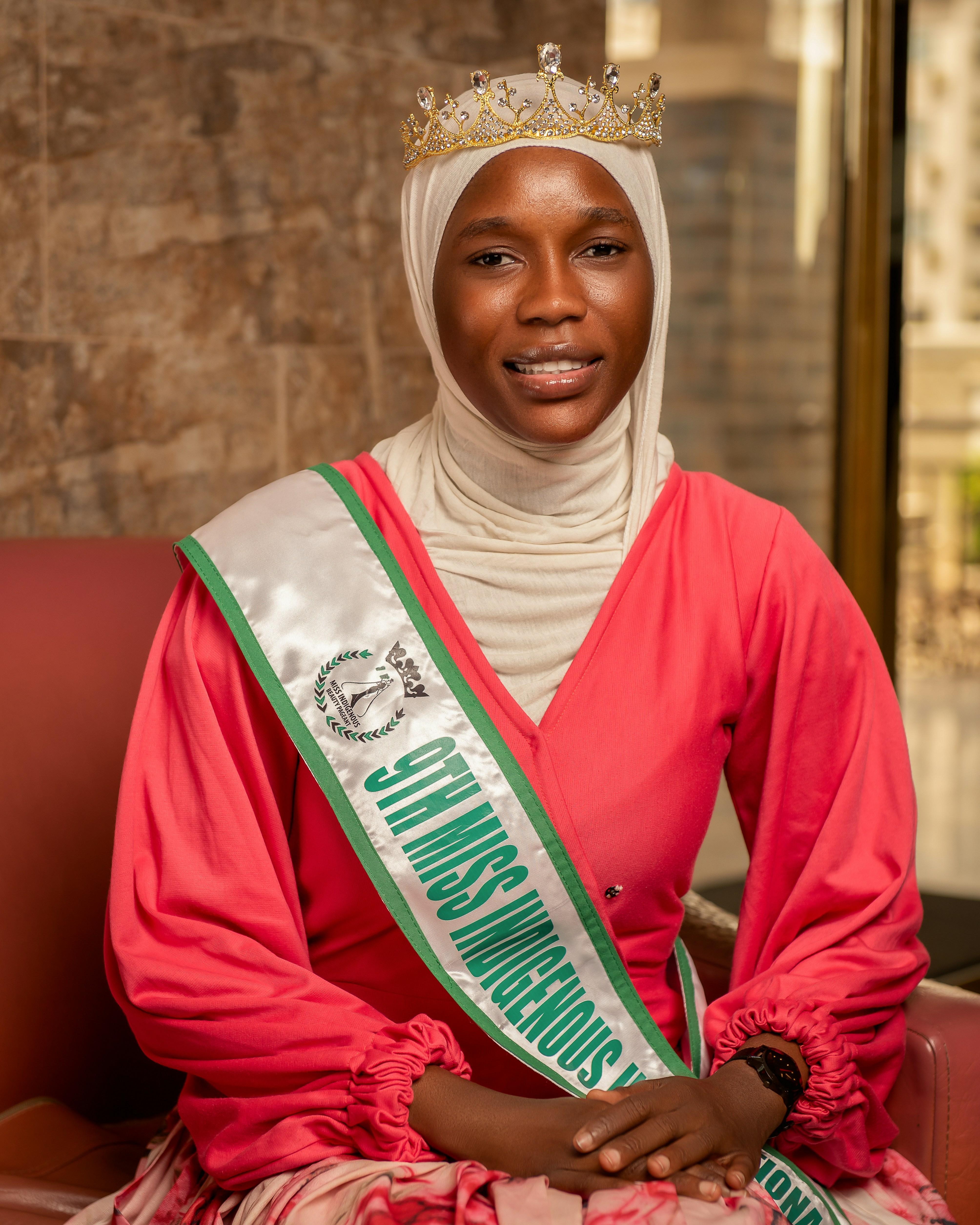 Young woman wearing a crown and sash