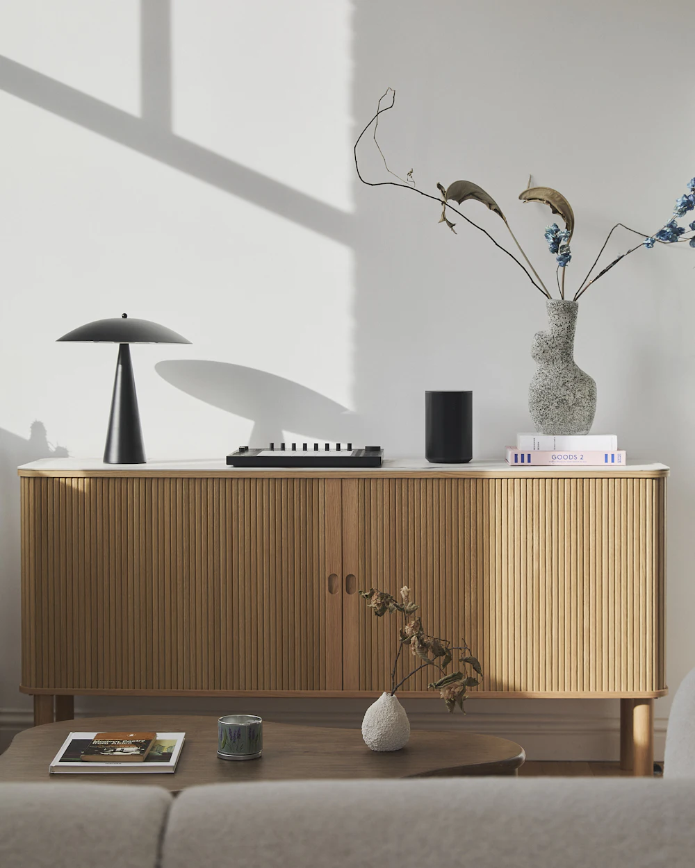 Floating light-timber sideboard in a neutral room, no people. Stock image, placeholder.
