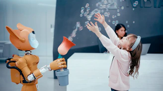 Robot blowing bubbles for a happy child