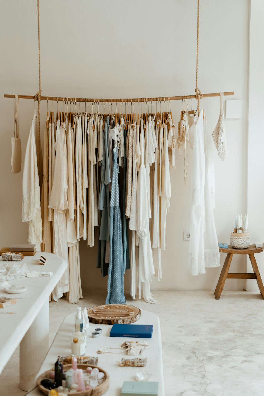 Sustainable fashion boutique with curated clothing on minimal rack