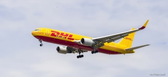 A dhl airplane flying in the sky