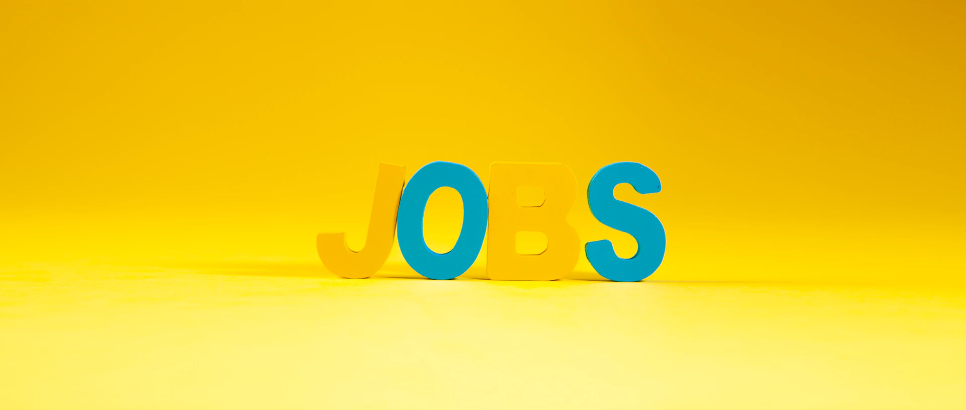 The word jobs in large letters on yellow