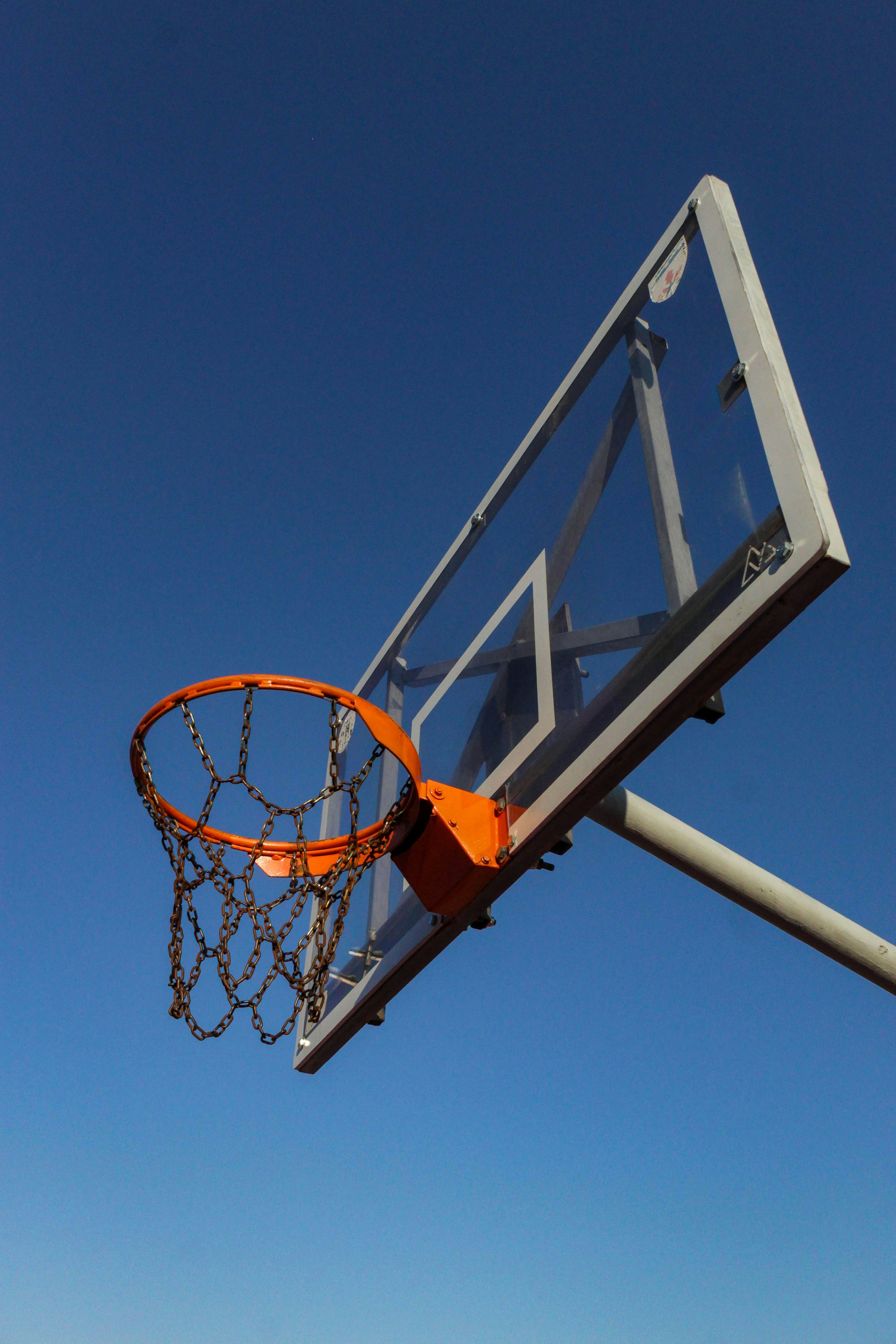 Basketball hoop against a clear blue sky
