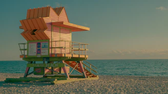 Orange lifeguard tower on a sandy miami beach