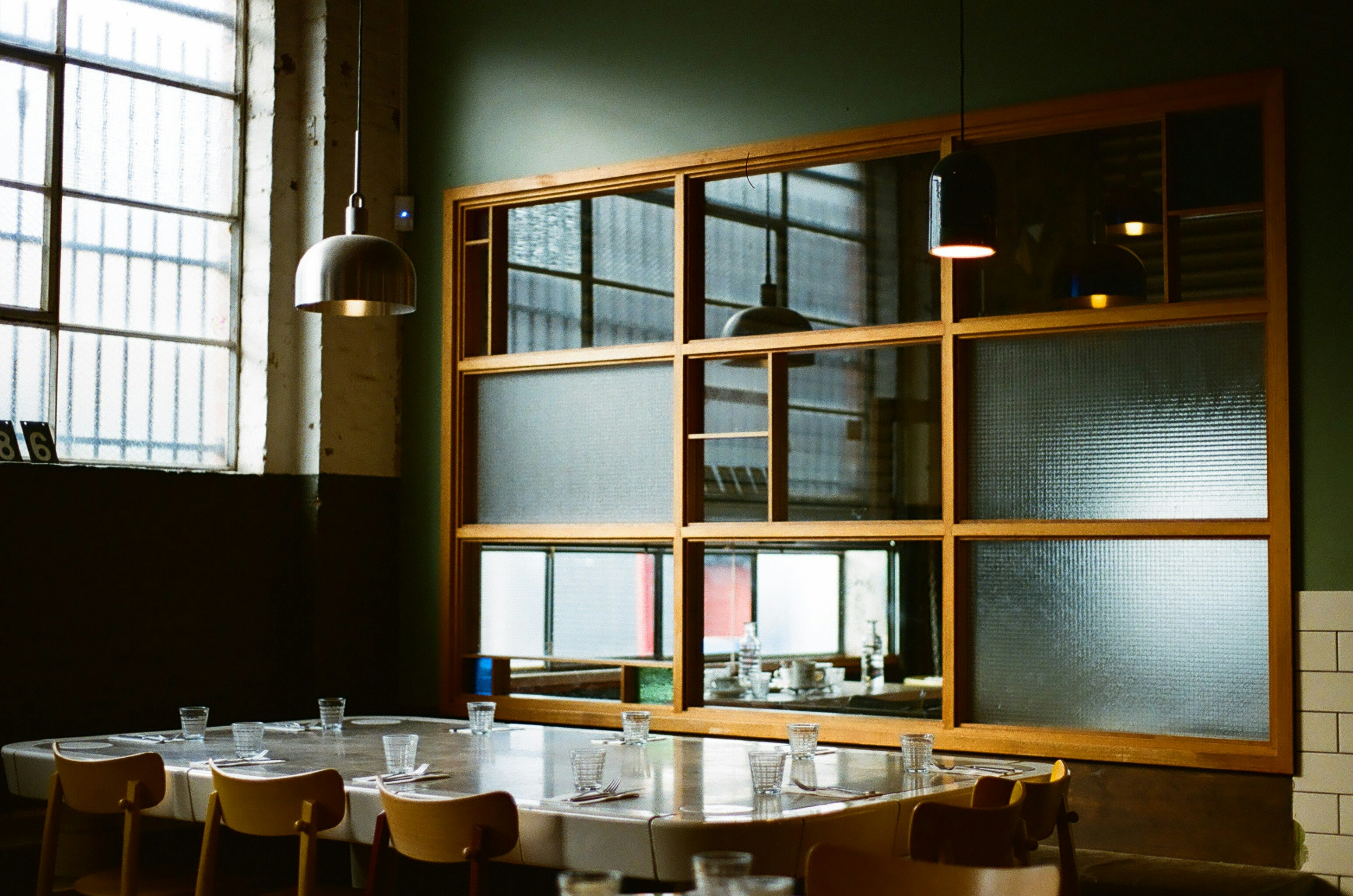 Restaurant dining area with large window and tables