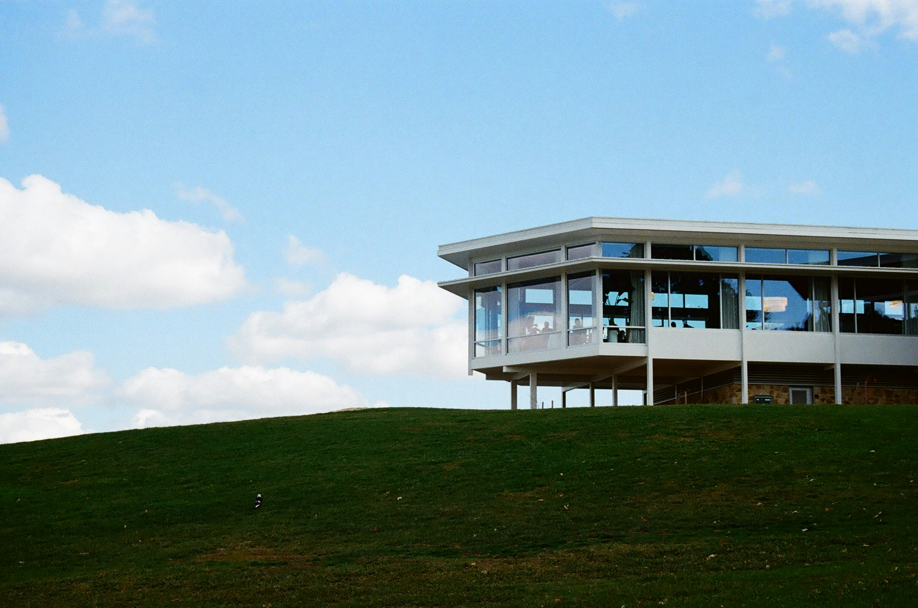Modern luxury estate exterior perched on a hill