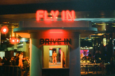 Neon sign for a drive-in at night
