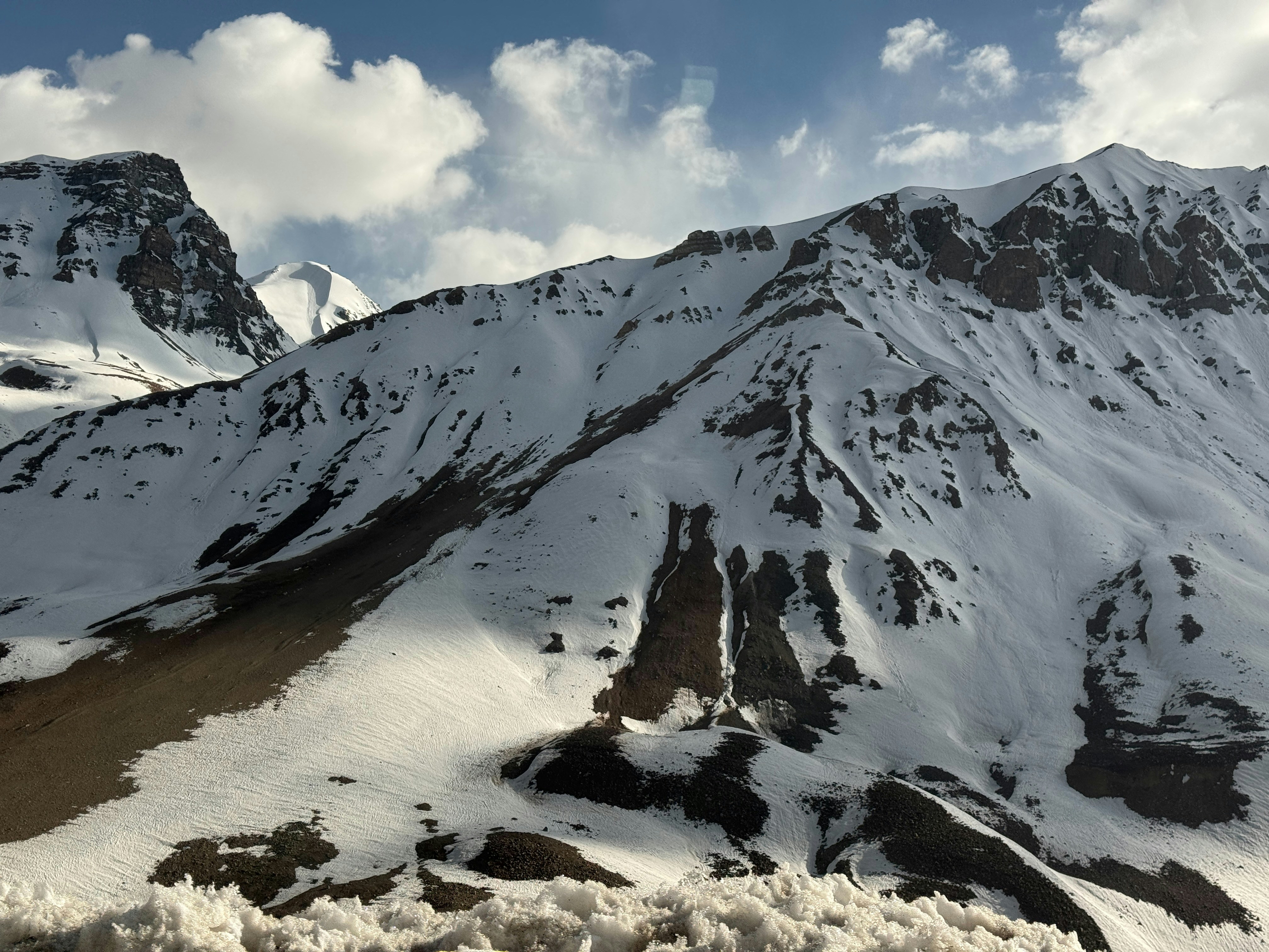 A split image showing Indian Army soldiers patrolling a snowy mountain pass on one side, and on the other, Defence Minister Rajnath Singh addressing a press conference.