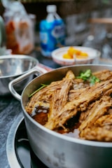 A close-up of a pot of braised meat.
