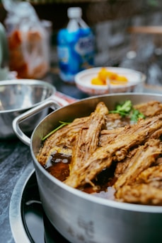A close-up of a pot of braised meat.