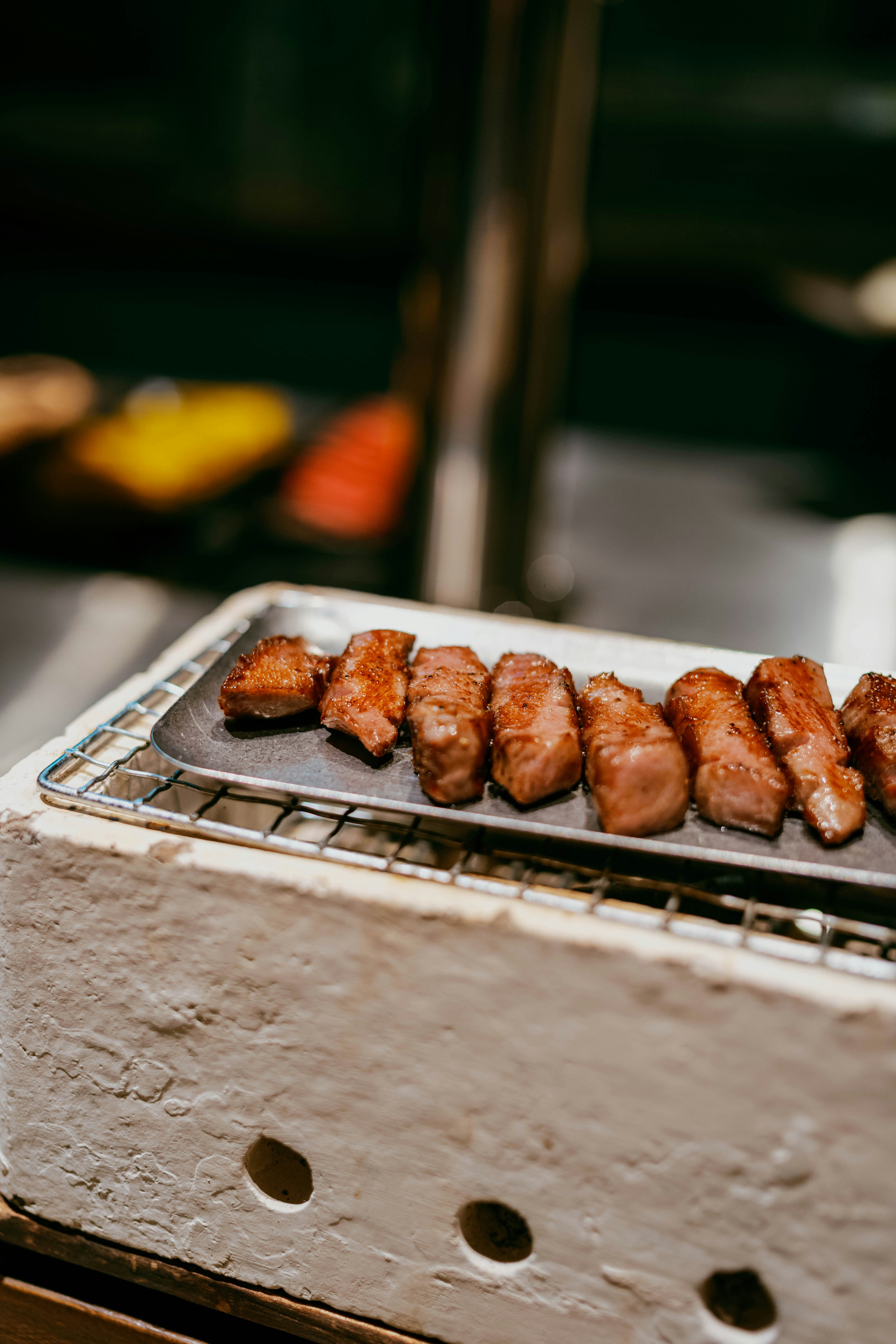 Grilled meat skewers on a serving platter