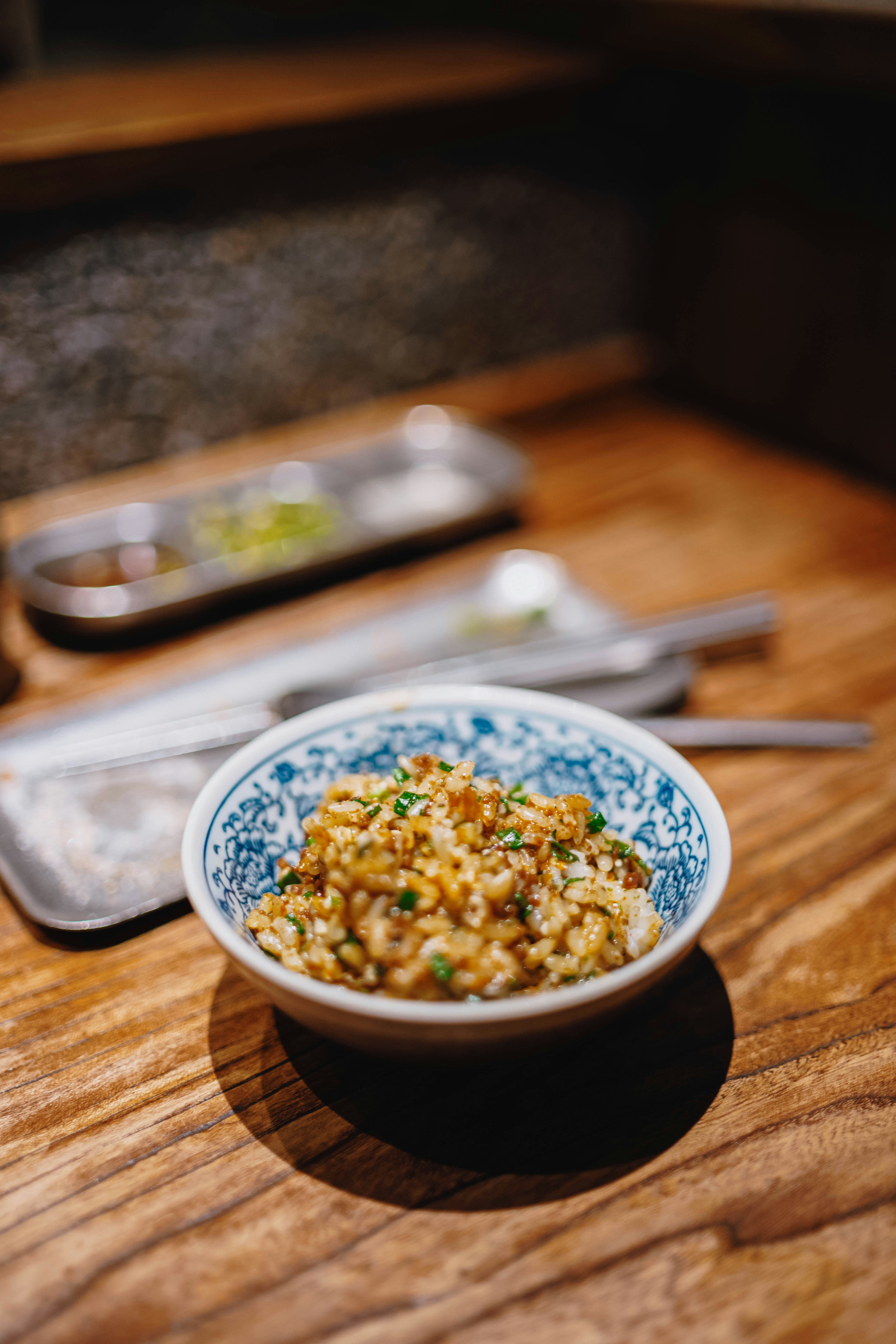 A small bowl of food with green garnish.